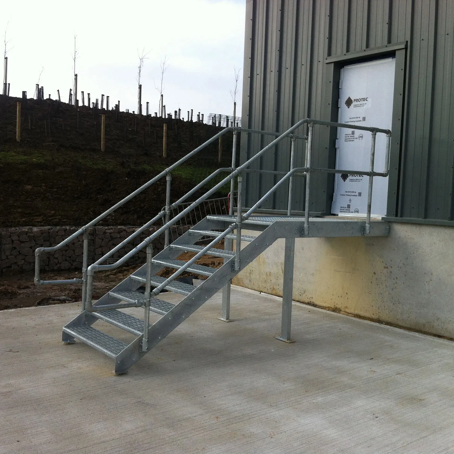 Outdoor handrails must be able to withstand the elements and high traffic use, which makes steel a good option for warehouses, factories, and other industrial buildings. Steel handrails for outside steps require very little maintenance and can resist rust for long periods of time.

GRP is also ideal for outside use, as this material is well-suited to rough environments and resistant to corrosion. GRP handrails can even outperform steel and wood, making them an excellent option for industrial use. Plus, GRP can weigh as much as 75% less than steel, so its higher strength-to-weight ratio works well for commercial construction.